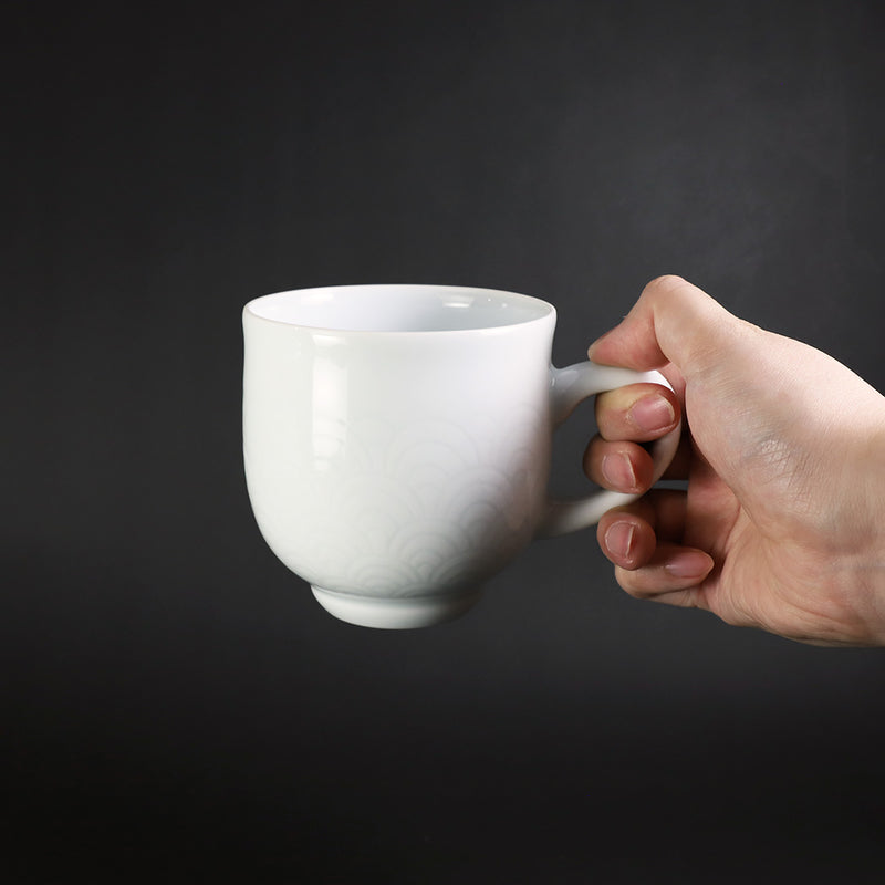 White porcelain morning cup with blue sea wave pattern by Manji Inoue