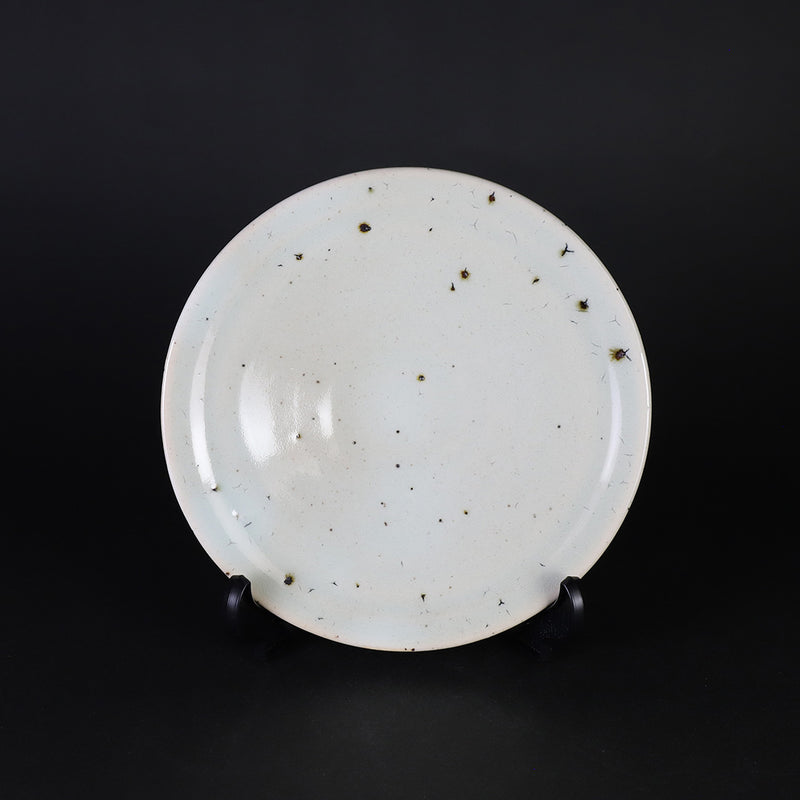 A small plate with blue and white glaze by Nakazato Taki
