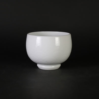 White porcelain sake cup with blue ocean wave pattern by Manji Inoue
