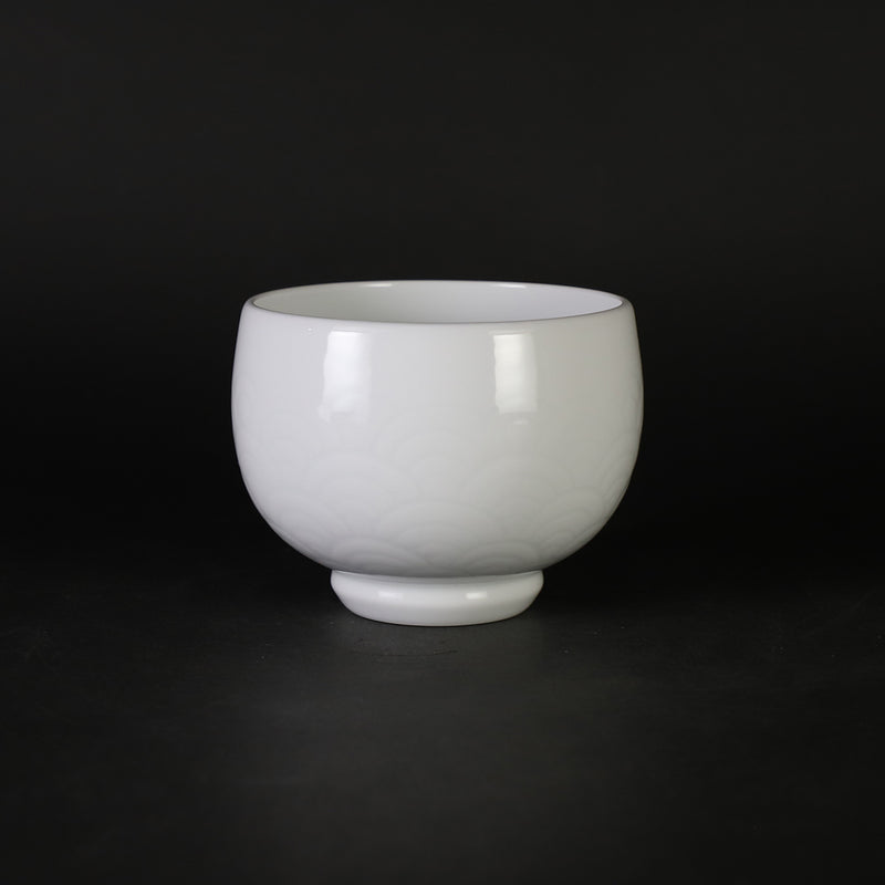White porcelain sake cup with blue ocean wave pattern by Manji Inoue