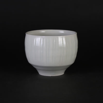 Small white porcelain teacup with ridged edge made by Shingo Oka