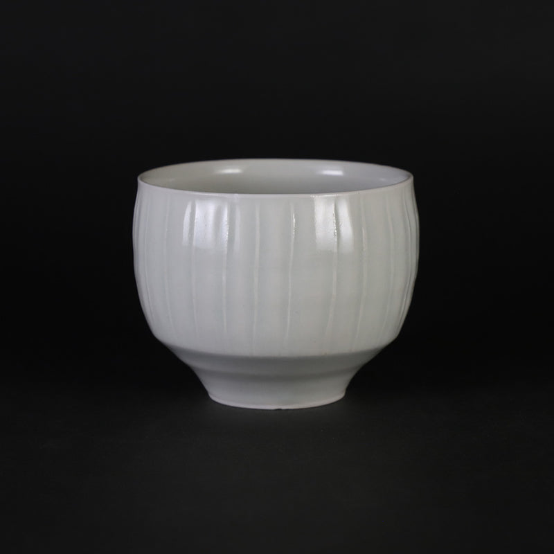 Small white porcelain teacup with ridged edge made by Shingo Oka