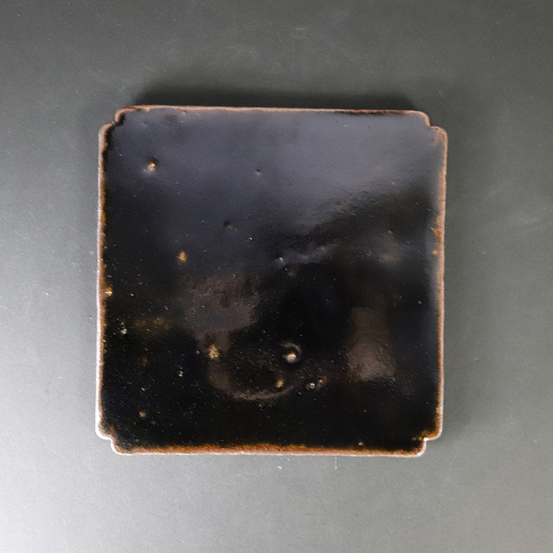 Set of black Karatsu arhat plates by Munehiko Maruta