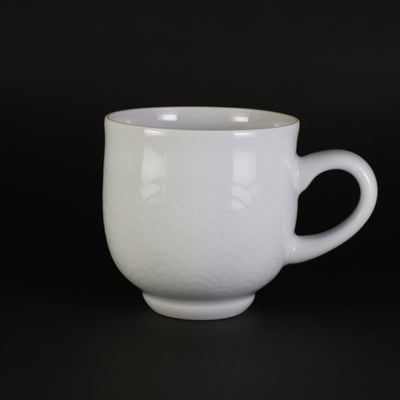 White porcelain morning cup with blue sea wave pattern by Manji Inoue