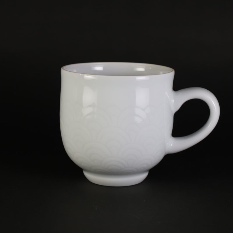 White porcelain morning cup with blue sea wave pattern by Manji Inoue