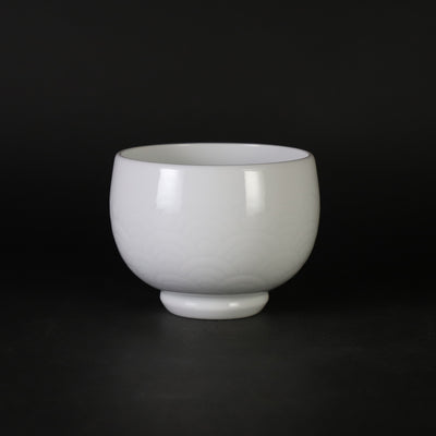 White porcelain sake cup with blue ocean wave pattern by Manji Inoue