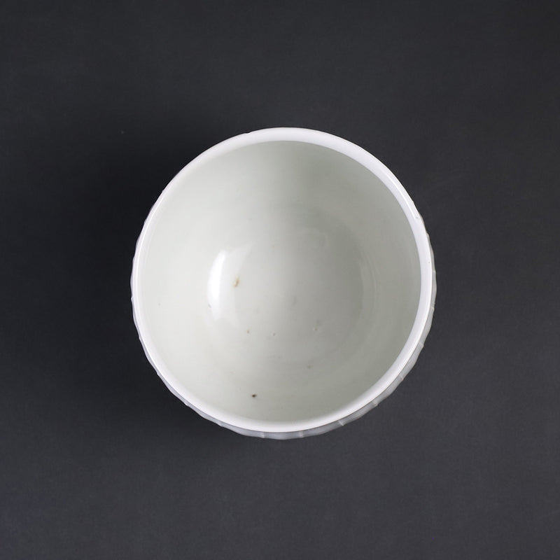 Small white porcelain teacup with ridged edge made by Shingo Oka