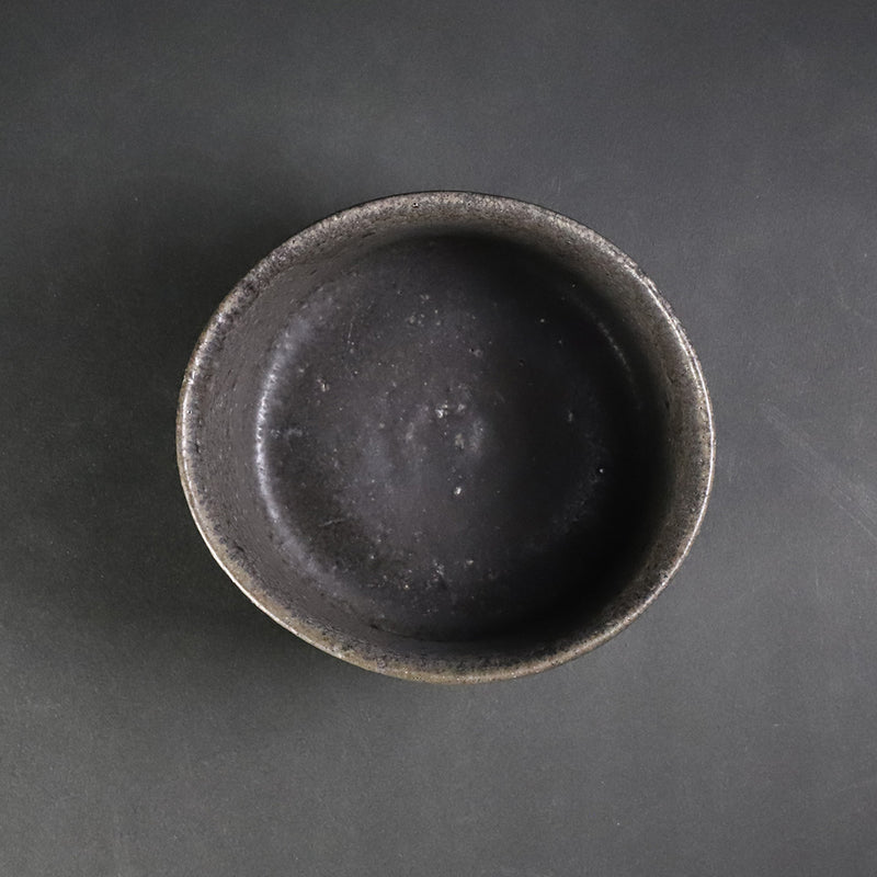 Black Karatsu tea bowl No.17 by Yasumoto Kajiwara