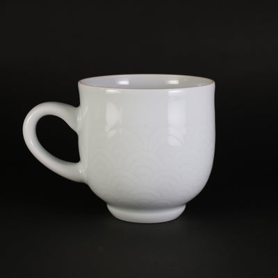 White porcelain morning cup with blue sea wave pattern by Manji Inoue