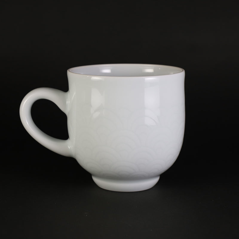 White porcelain morning cup with blue sea wave pattern by Manji Inoue