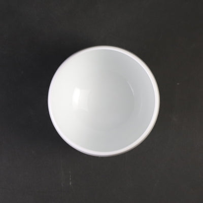 White porcelain sake cup with blue ocean wave pattern by Manji Inoue