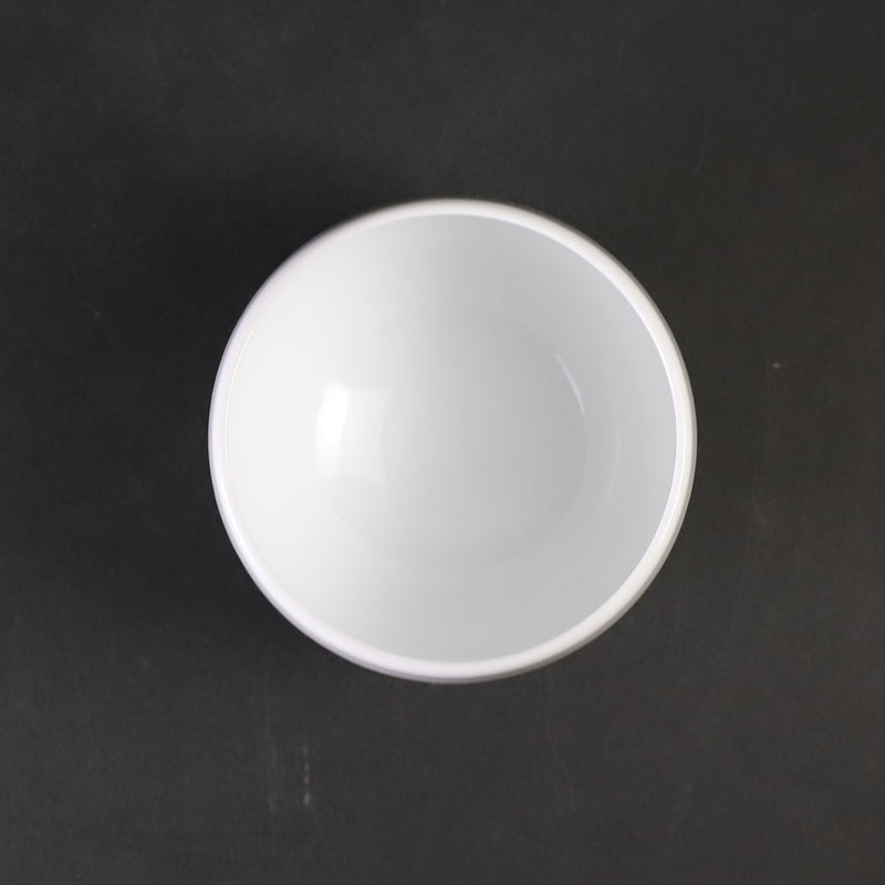 White porcelain sake cup with blue ocean wave pattern by Manji Inoue