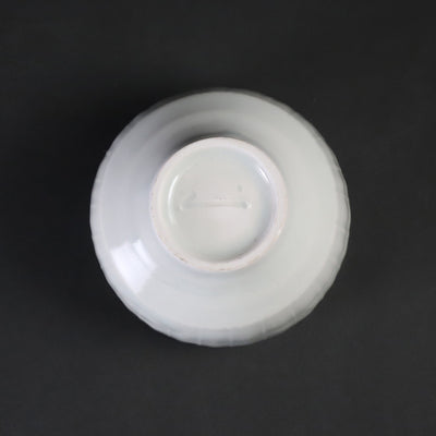 Small white porcelain teacup with ridged edge made by Shingo Oka