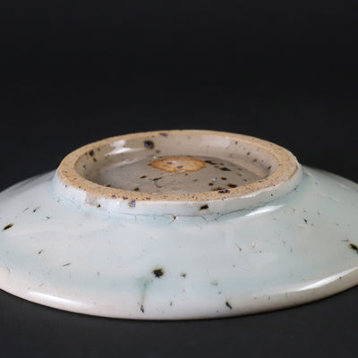 A small plate with blue and white glaze by Nakazato Taki