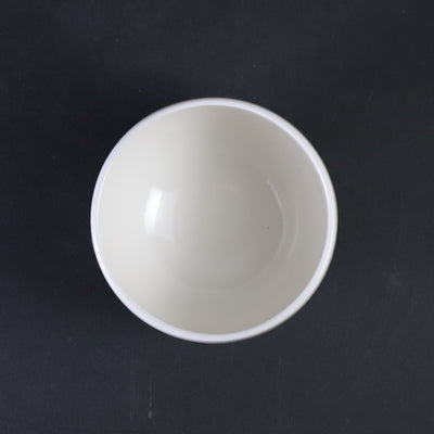 White porcelain sake cup with blue sea wave pattern by Manji Inoue