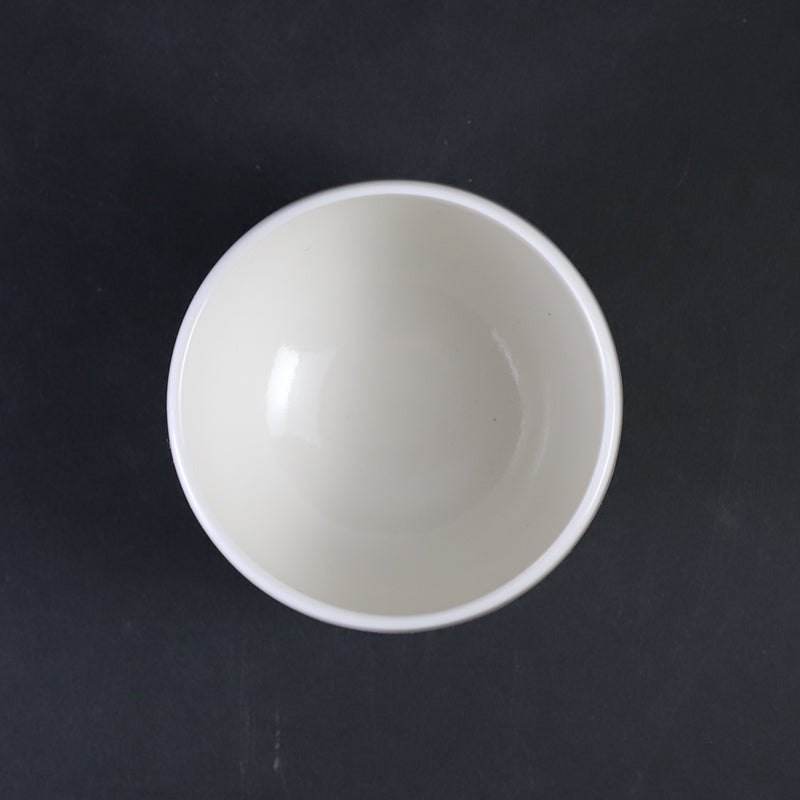 White porcelain sake cup with blue sea wave pattern by Manji Inoue