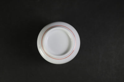 A sake cup with a strawberry design by the 15th generation Sakaida Kakiemon