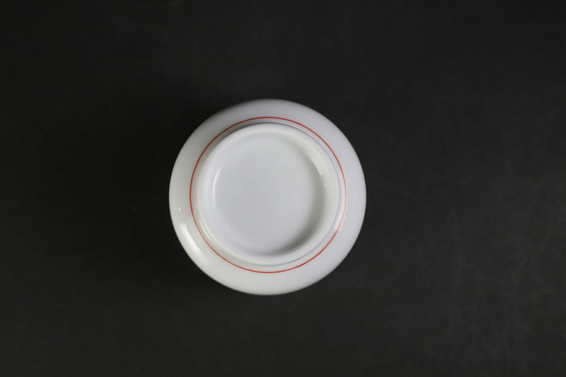 A sake cup with a strawberry design by the 15th generation Sakaida Kakiemon