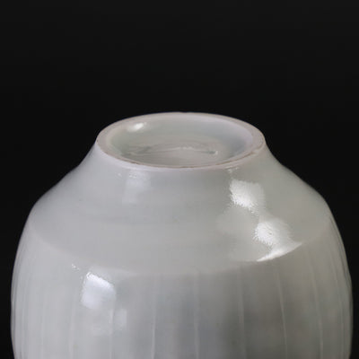 Small white porcelain teacup with ridged edge made by Shingo Oka
