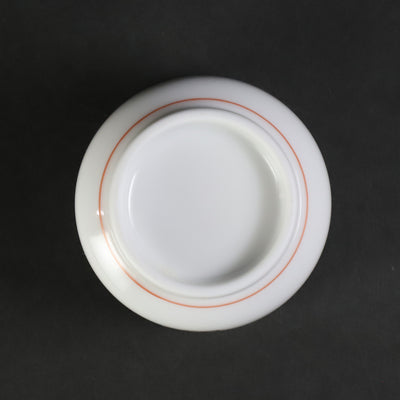 A murky-hand cherry blossom design sake cup made by the 15th generation Sakaida Kakiemon