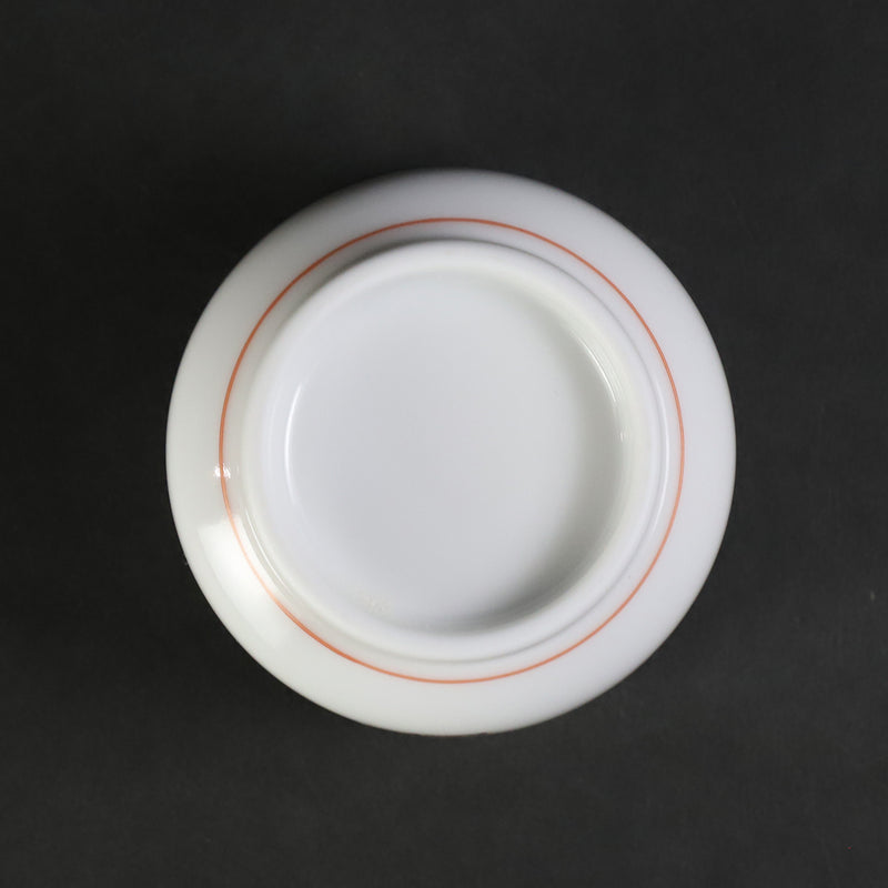 A murky-hand cherry blossom design sake cup made by the 15th generation Sakaida Kakiemon