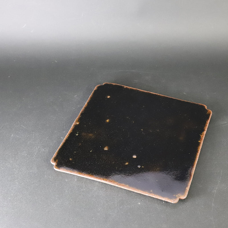 Set of black Karatsu arhat plates by Munehiko Maruta