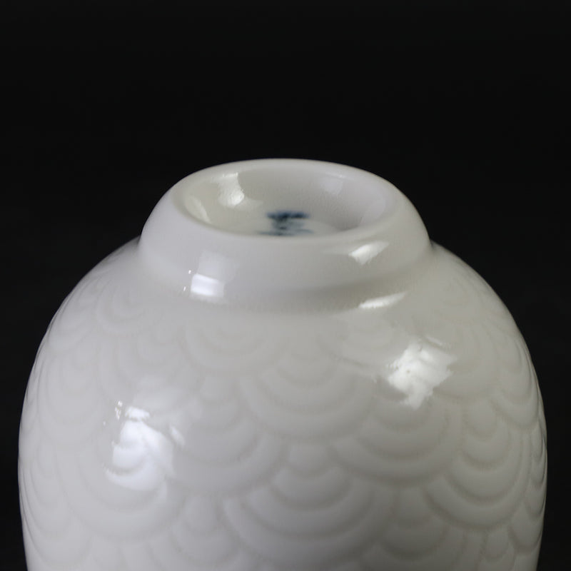 White porcelain sake cup with blue sea wave pattern by Manji Inoue