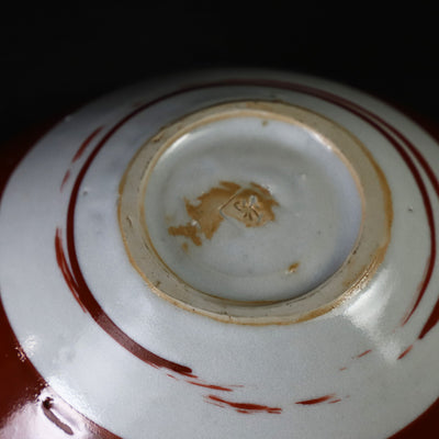 Red-painted dot patterned shoe-mounted bowl by Shingo Oka