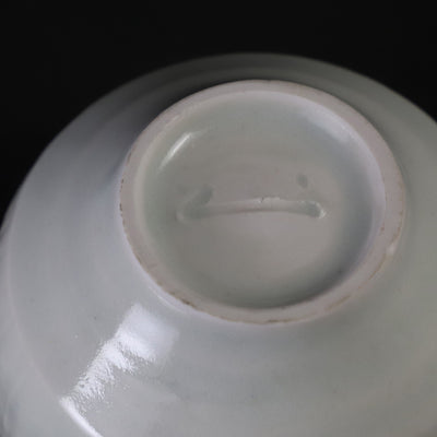 Small white porcelain teacup with ridged edge made by Shingo Oka