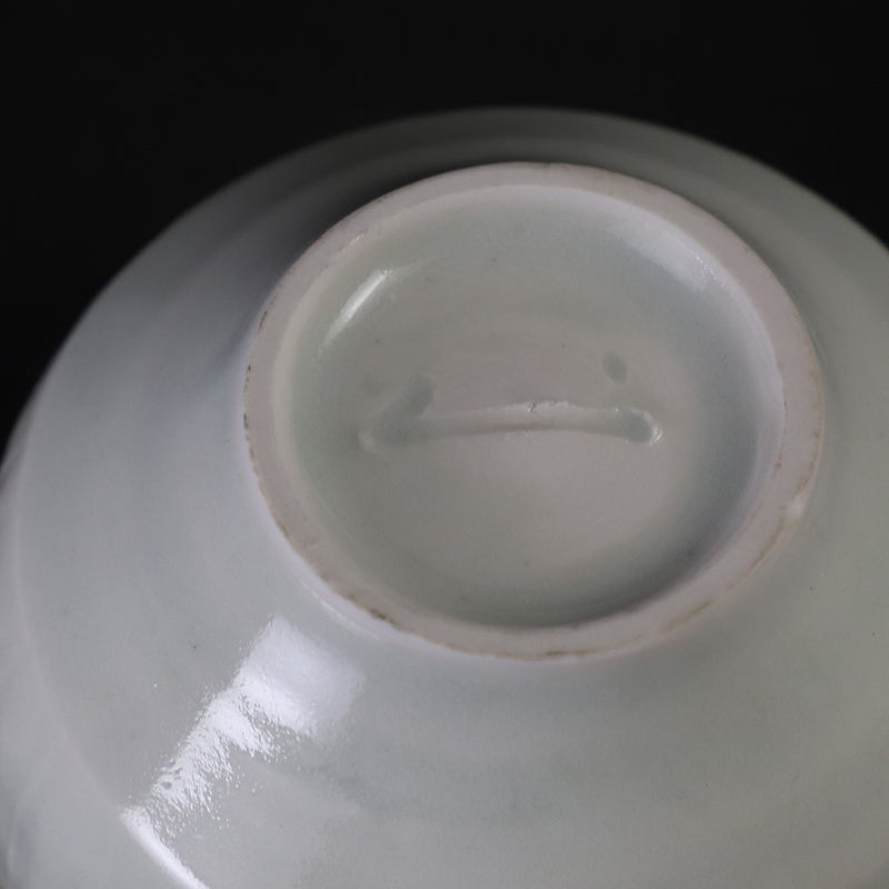 Small white porcelain teacup with ridged edge made by Shingo Oka