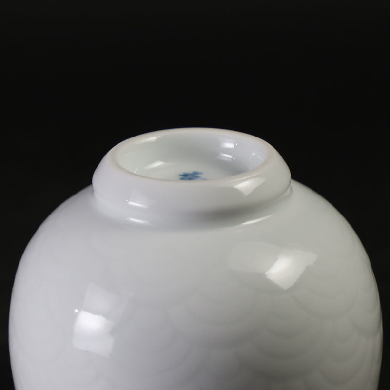 White porcelain sake cup with blue ocean wave pattern by Manji Inoue