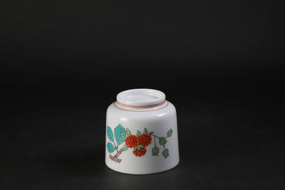 A sake cup with a strawberry design by the 15th generation Sakaida Kakiemon