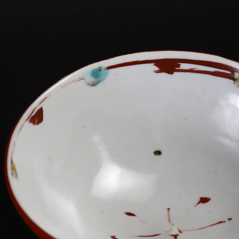 Red-painted dot patterned shoe-mounted bowl by Shingo Oka