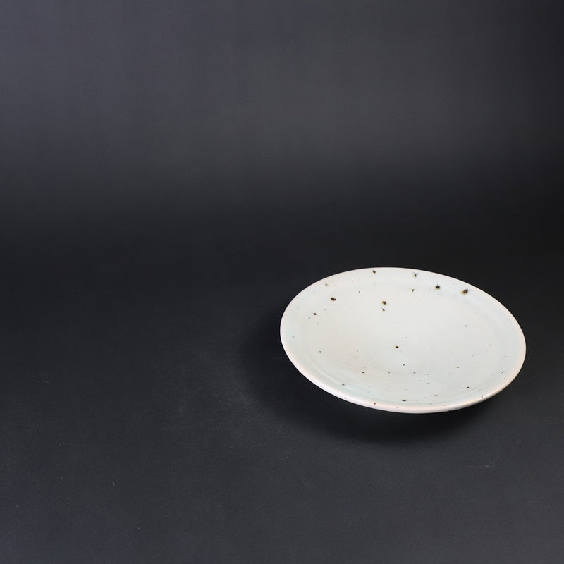 A small plate with blue and white glaze by Nakazato Taki