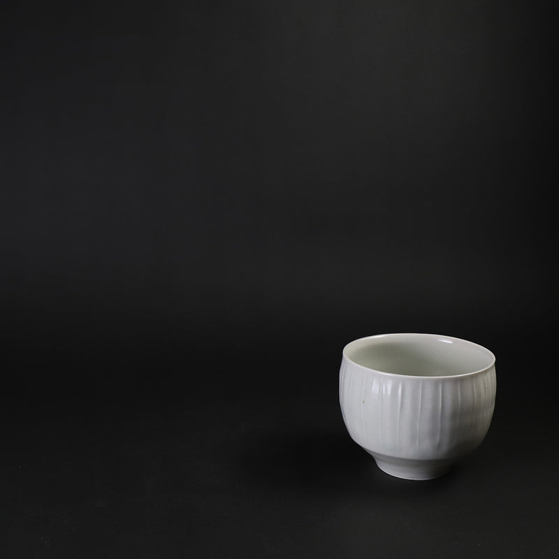 Small white porcelain teacup with ridged edge made by Shingo Oka