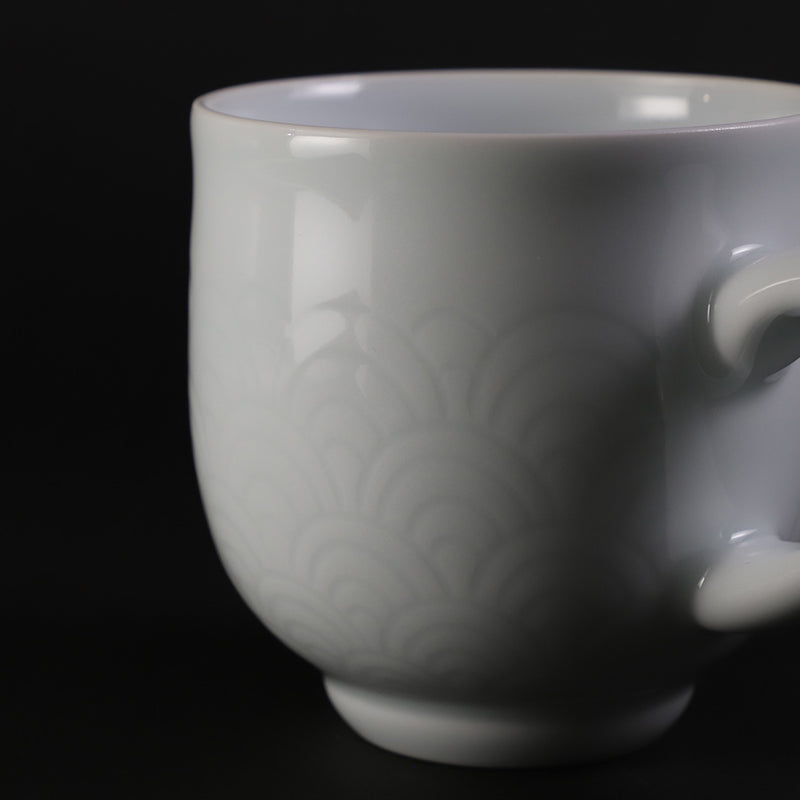 White porcelain morning cup with blue sea wave pattern by Manji Inoue