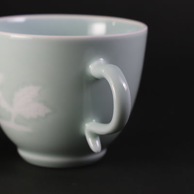 Blue and white porcelain coffee bowl with rose design by Manji Inoue