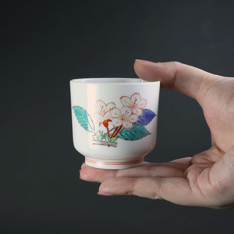 A murky-hand cherry blossom design sake cup made by the 15th generation Sakaida Kakiemon