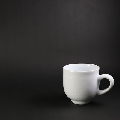 White porcelain morning cup with blue sea wave pattern by Manji Inoue