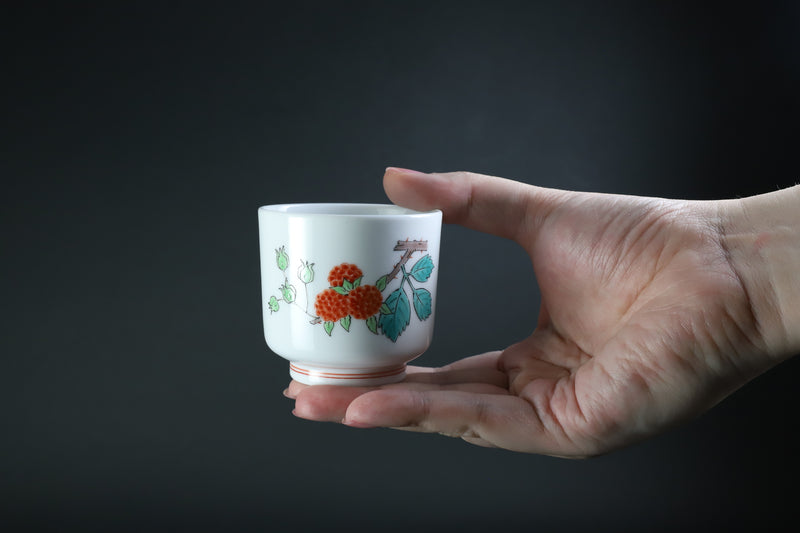 A sake cup with a strawberry design by the 15th generation Sakaida Kakiemon