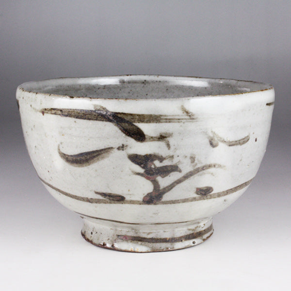 Iron-painted tea bowl by Shingo Oka