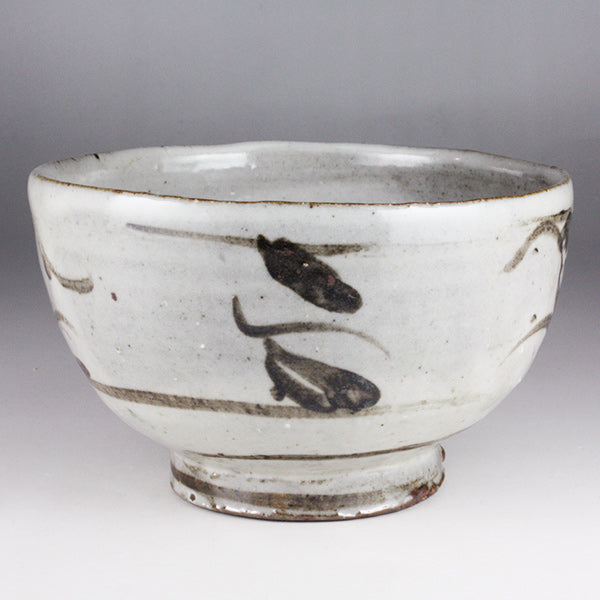 Iron-painted tea bowl by Shingo Oka