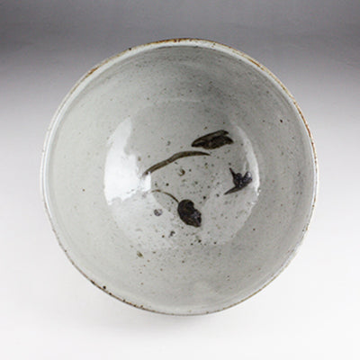 Iron-painted tea bowl by Shingo Oka