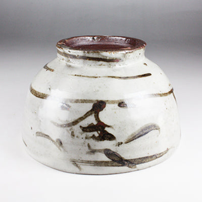 Iron-painted tea bowl by Shingo Oka