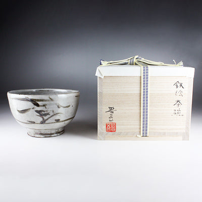 Iron-painted tea bowl by Shingo Oka