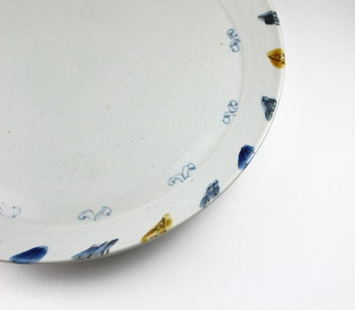 8-sun plate with twisted flower design by Shingo Oka
