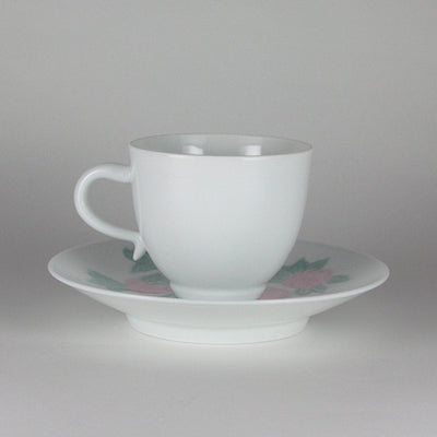 Manji Inoue white porcelain coffee bowl with green glaze and cherry blossom engraving