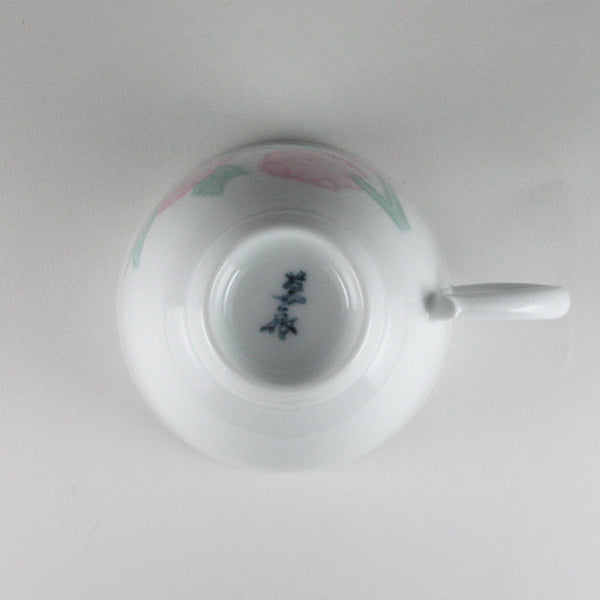 Manji Inoue white porcelain coffee bowl with green glaze and cherry blossom engraving