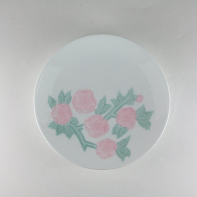 Manji Inoue white porcelain coffee bowl with green glaze and cherry blossom engraving