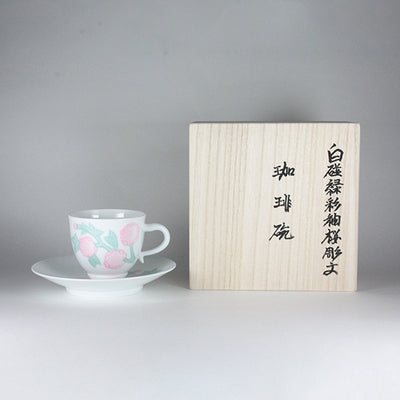 Manji Inoue white porcelain coffee bowl with green glaze and cherry blossom engraving